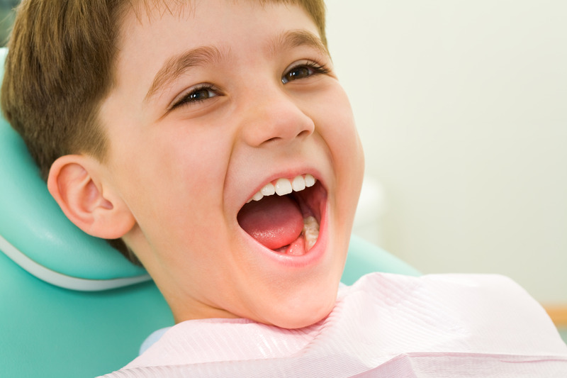 Child smiling as they recover from tongue-ties